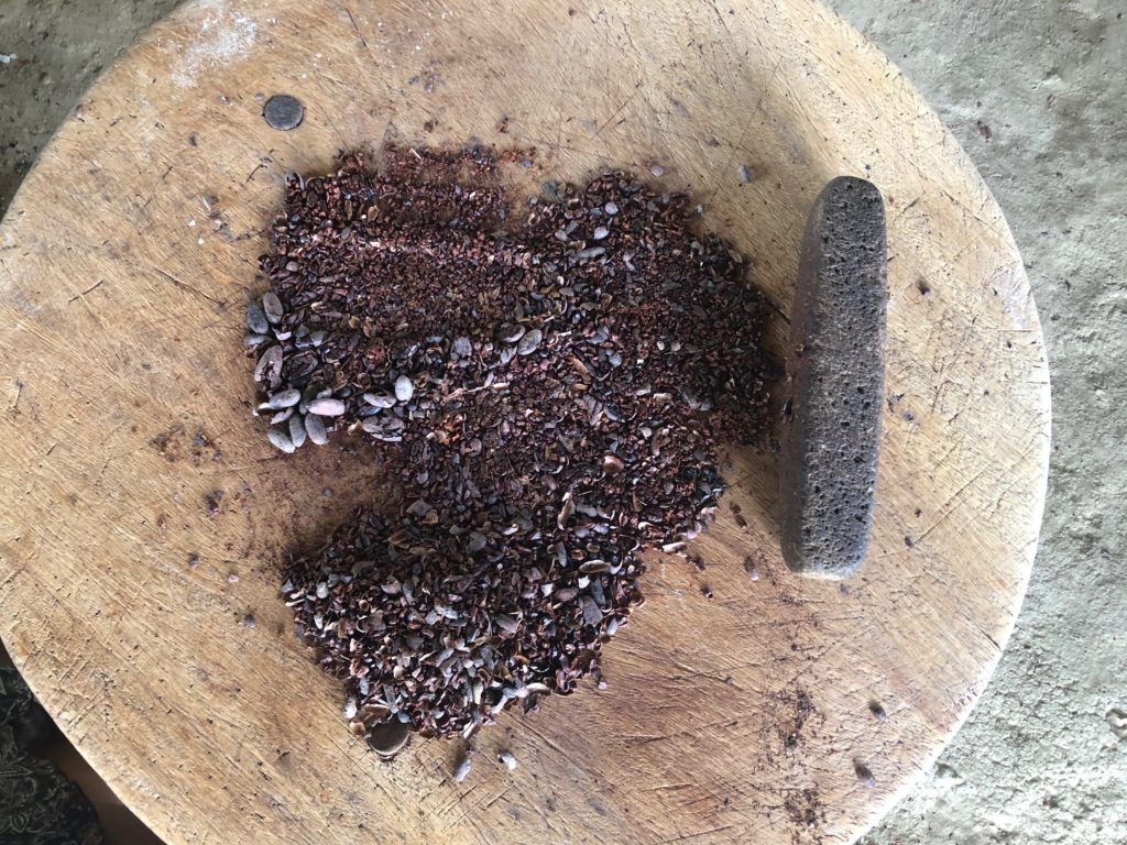 Crushing cacao beans Belize