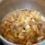 Cooking apples in apply juice and brown sugar