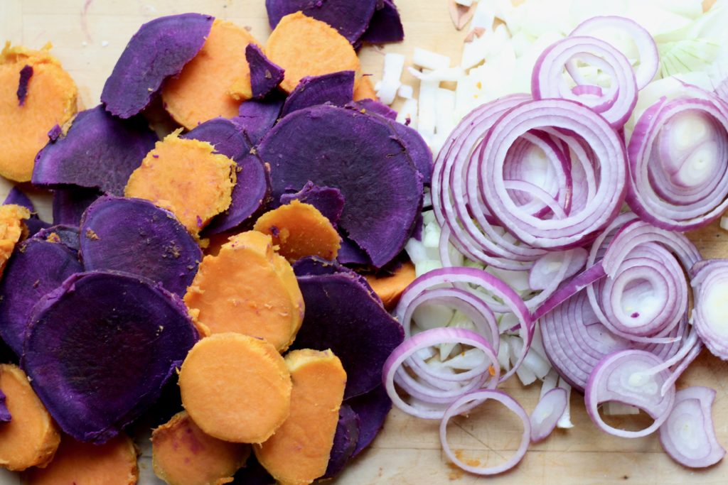 Purple and orange sweet potatoes red onions