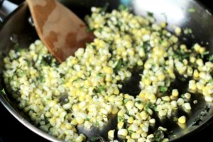 Saute corn and herbs