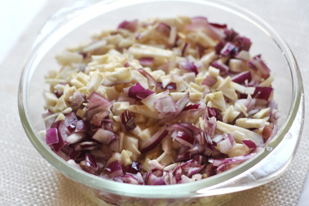 Diced red onion, garlic, celery root and potatoes