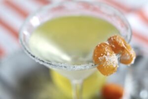 Candied kumquats garnish on a Kumquat Vodka Martini