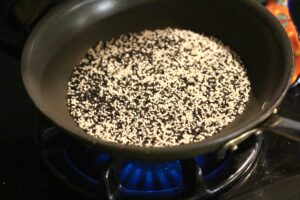 toasting black and white sesame seeds.