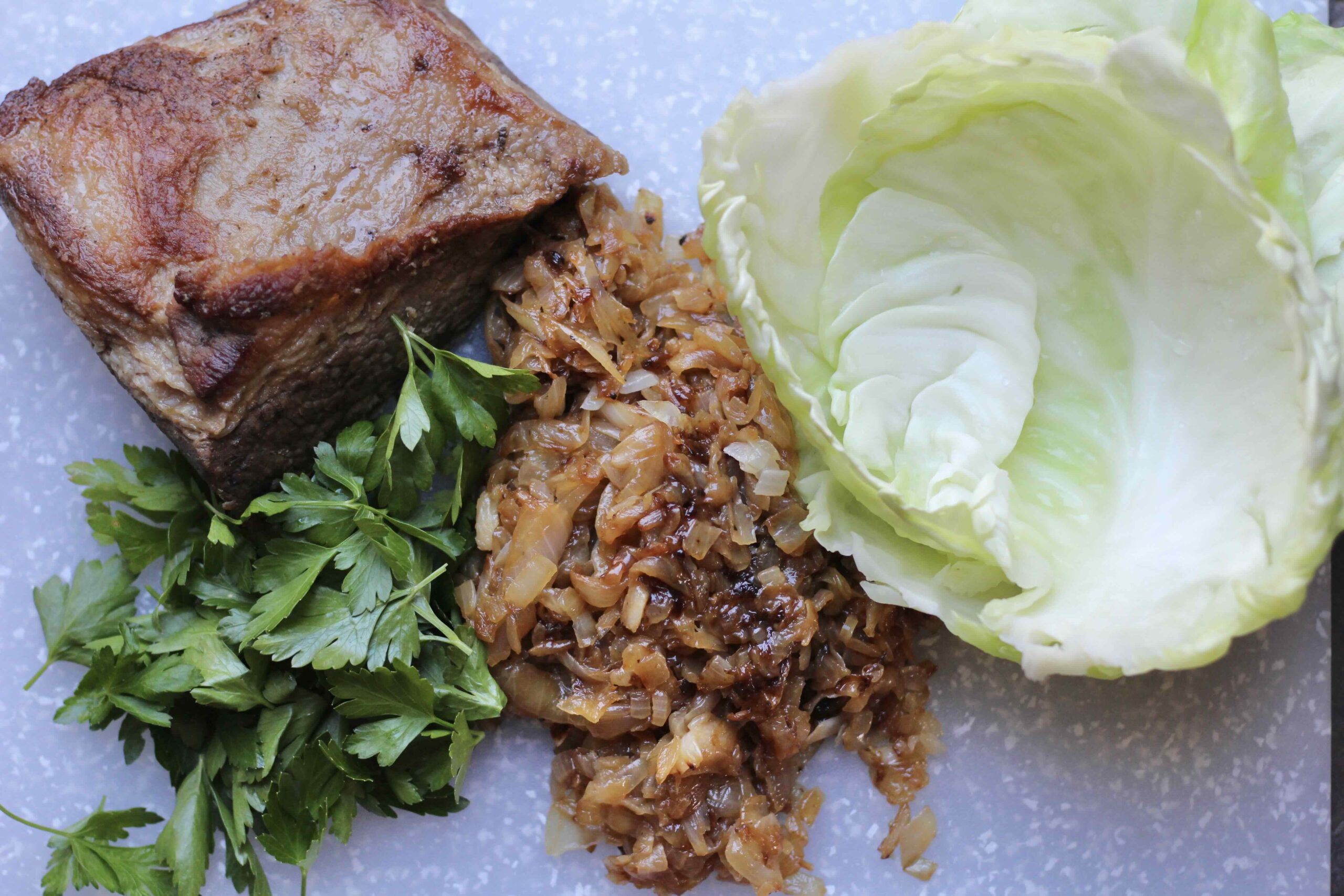 Brisket, Parsley, caramelized onions, and cabbage leaves