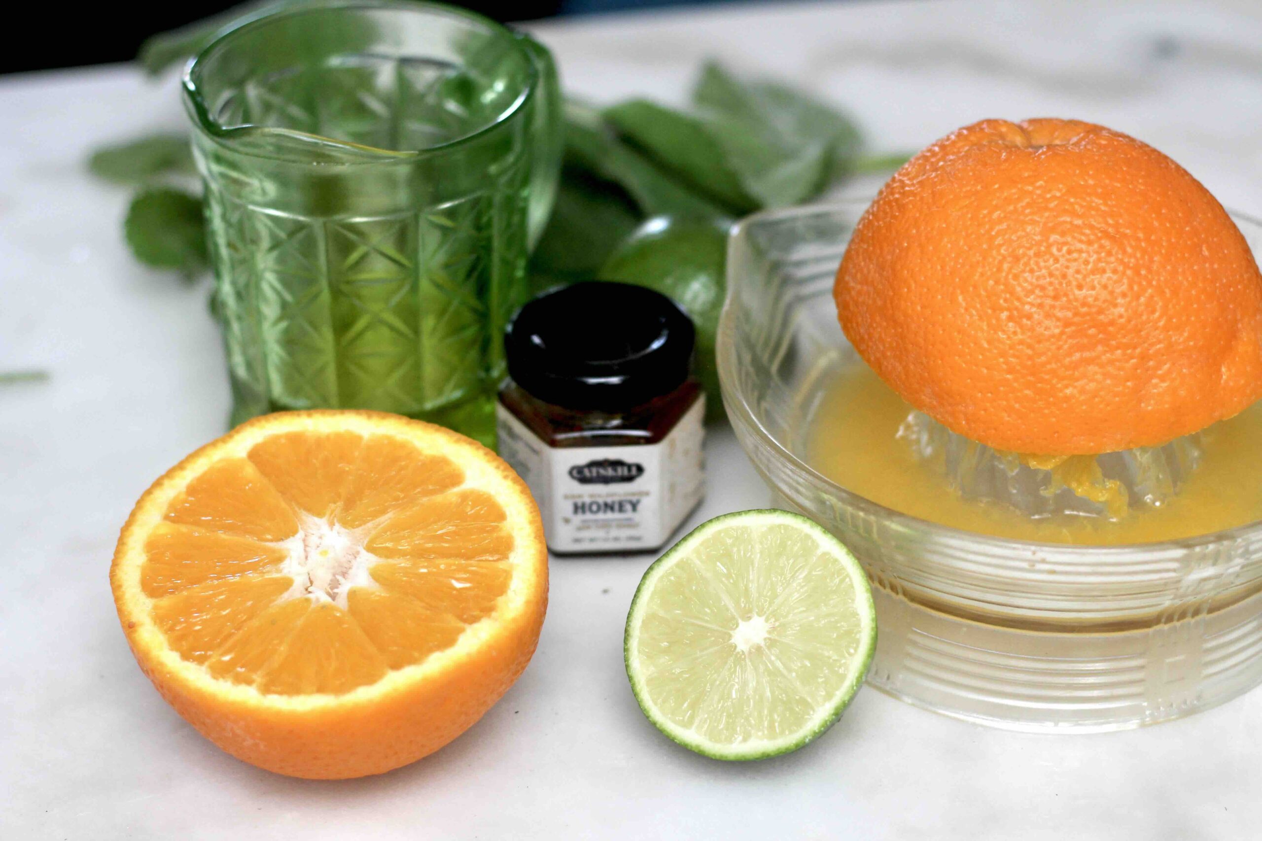 squeezing orange lime juice honey