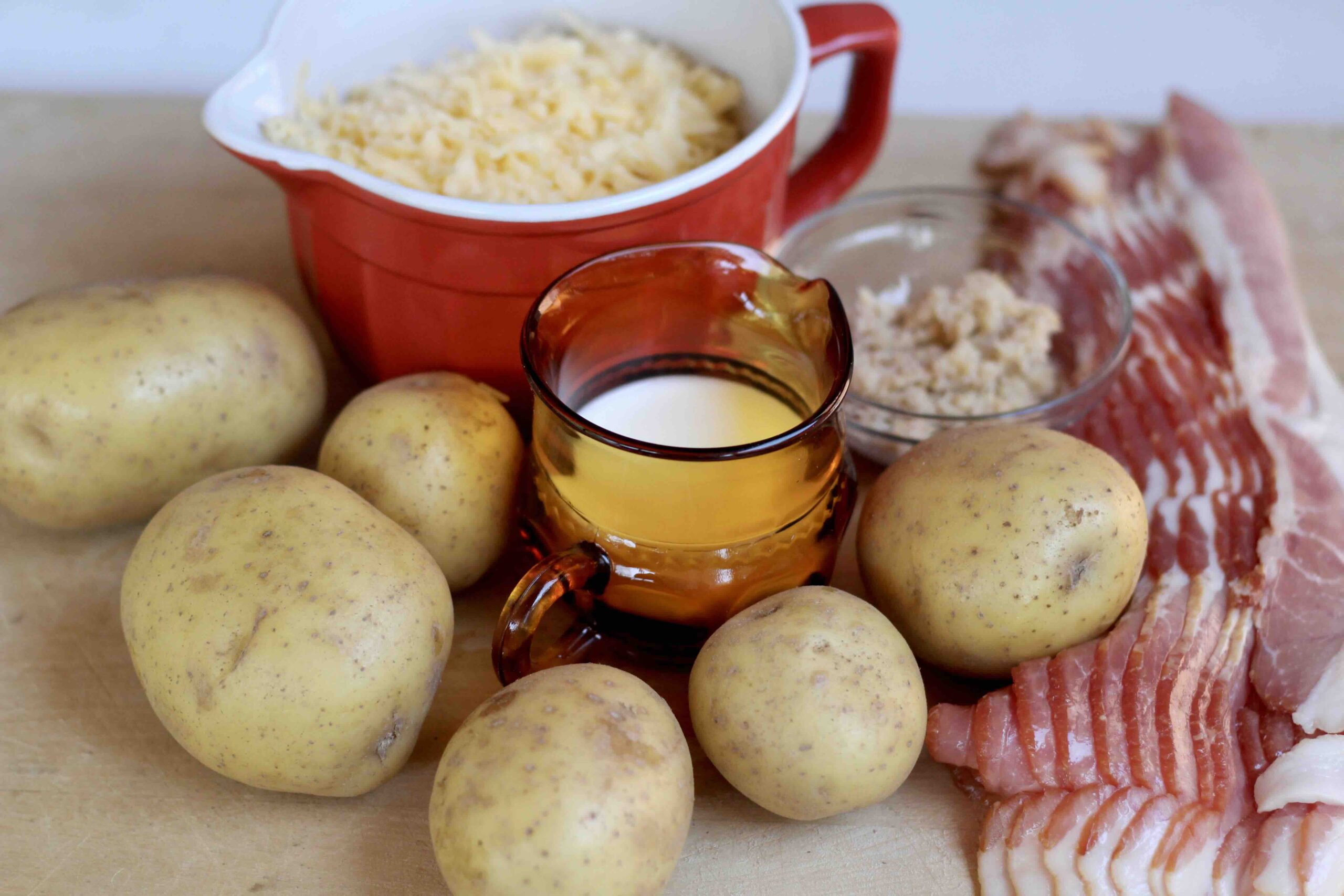 grated gouda, potatoes, milk, horseradish