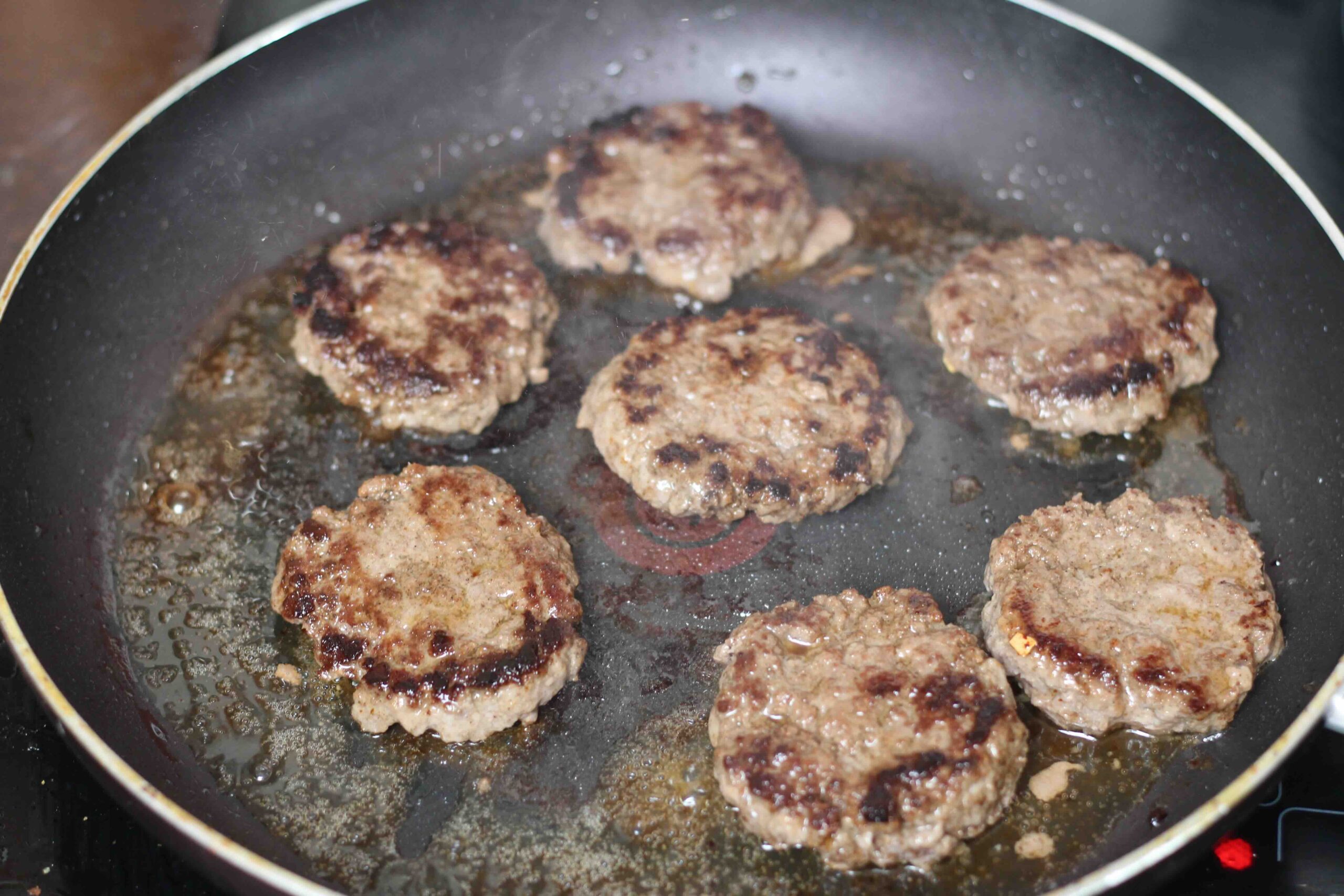 Frying-beef-sliders making sliders