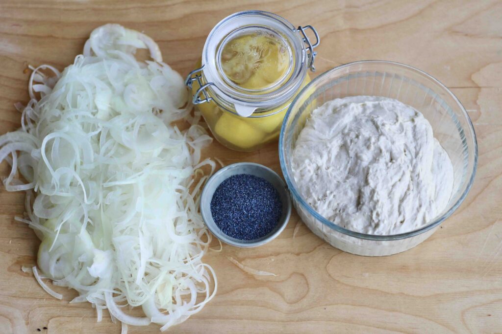 Raw Onion rings, preserved lemons, poppy seeds, dough